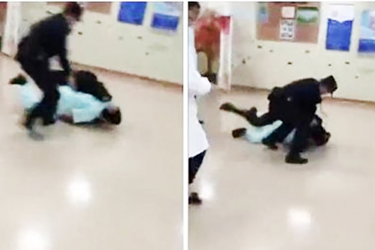 上海仁济医院知名胸外科专家赵晓菁因禁止病人插队,被警察掀翻在地后用手铐铐走。(视频截图)